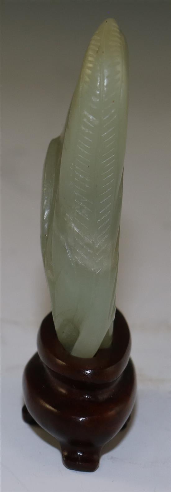 A Chinese celadon jade carving of gourds, 18th/19th century, 6cm, wood stand